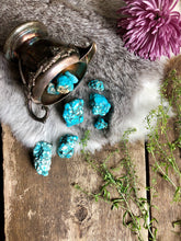 Load image into Gallery viewer, Large turquoise dyed howlite crystals spill out of vintage silver bowl onto fur, aged wood and pretty flowers

